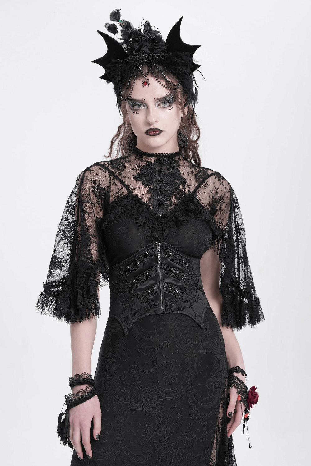 Model wearing a gothic lace-up corset belt with lace details and intricate beading, styled for an edgy look.