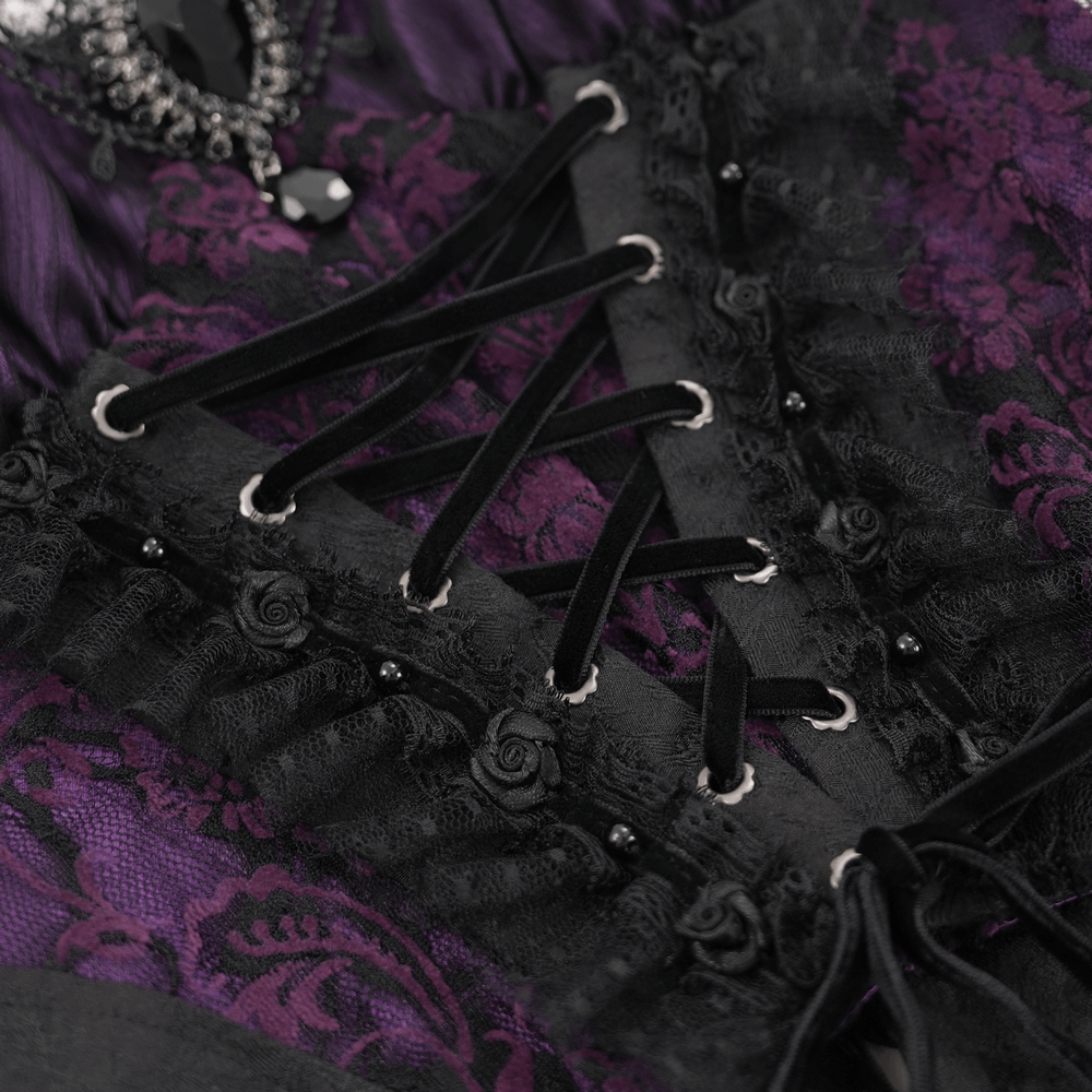 Close-up of Gothic Lace-Up Corset Top featuring intricate lace, purple and black floral accents, and adjustable straps.