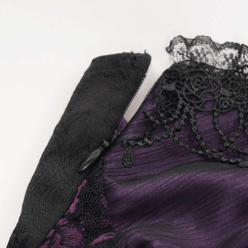 Close-up of Gothic lace-up corset top featuring black lace and deep purple fabric, with intricate detailing and zipper.