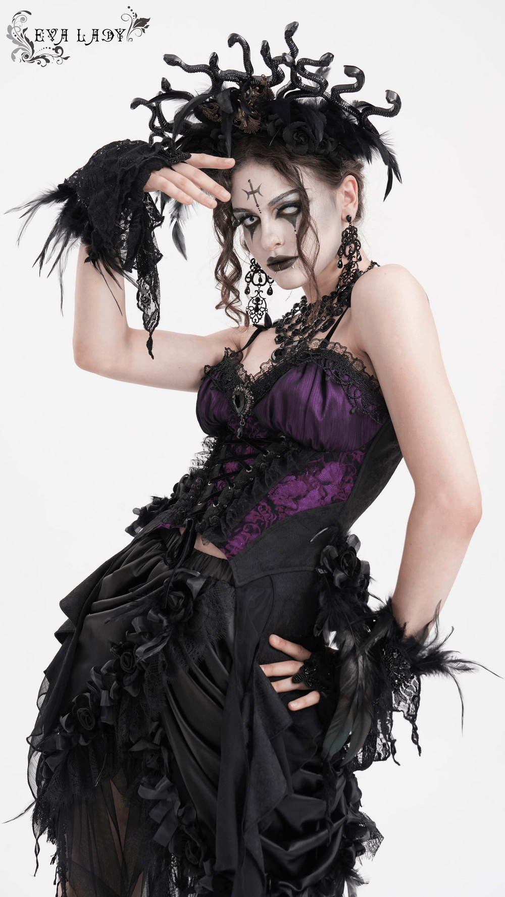 Model wearing a gothic lace-up corset top with purple and black floral accents, showcasing Victorian-inspired elegance.