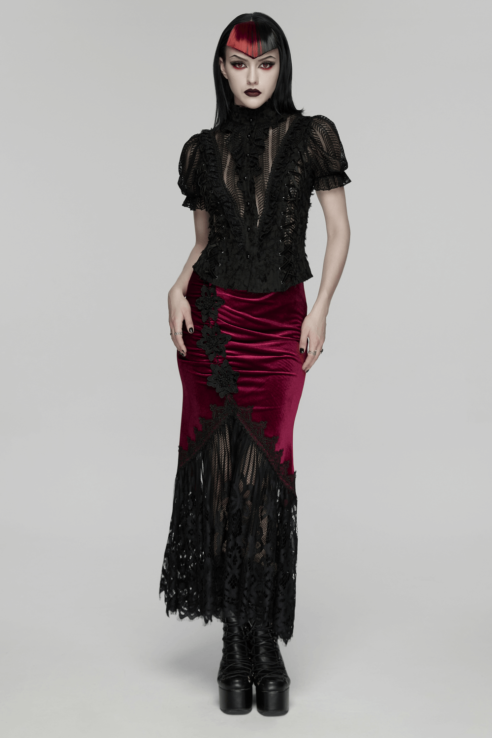 Gothic Lace-Up Decadent Shirt with Bubble Sleeves worn with a dramatic velvet skirt, exuding a striking gothic vibe.