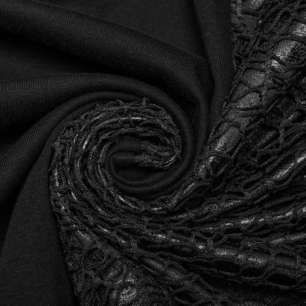 Close-up of elegant black fabric and lace, showcasing gothic lace details for a stylish dress.