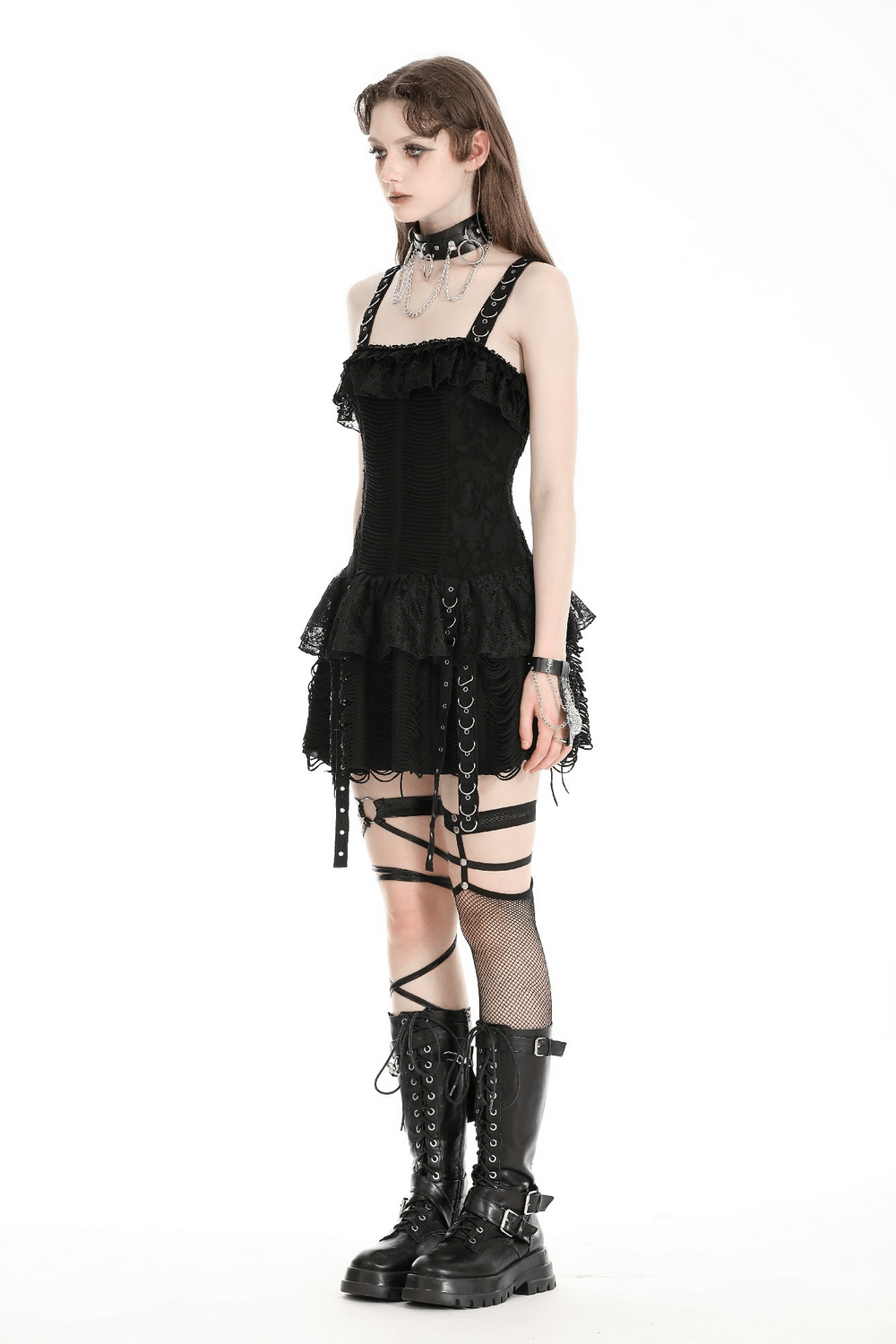 Model showcases a Gothic Lace-Up Dress with ruffles and lace accents, styled with combat boots and accessories.