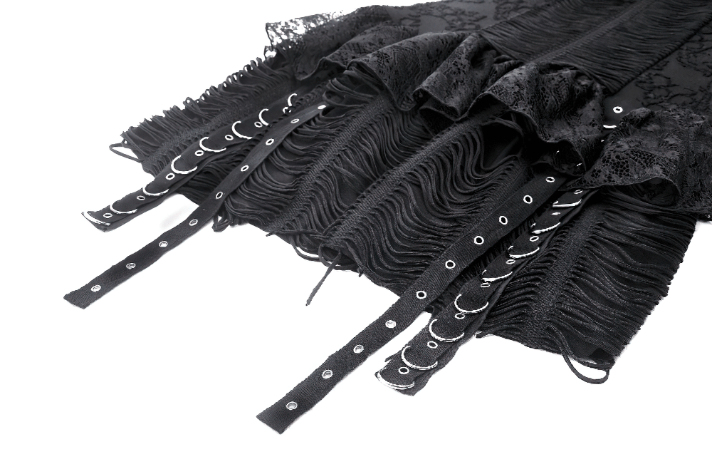 Close-up of Gothic lace-up dress showing ruffle and eyelet details with black lace and fabric accents.