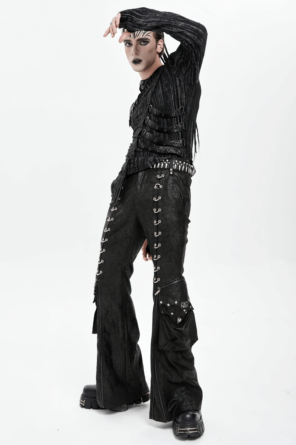 Gothic Lace Up Flared Pants with Metal Eyelet Details worn by a model, showcasing studded panels and dramatic flares.