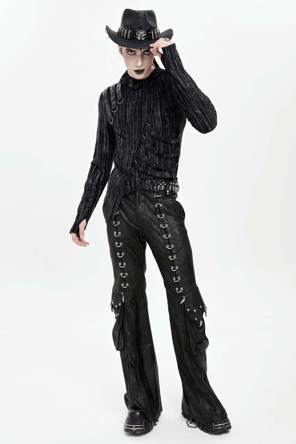 Gothic Lace Up Flared Pants with Metal Eyelet Details styled with a dark shirt and hat for a dramatic alt fashion look.