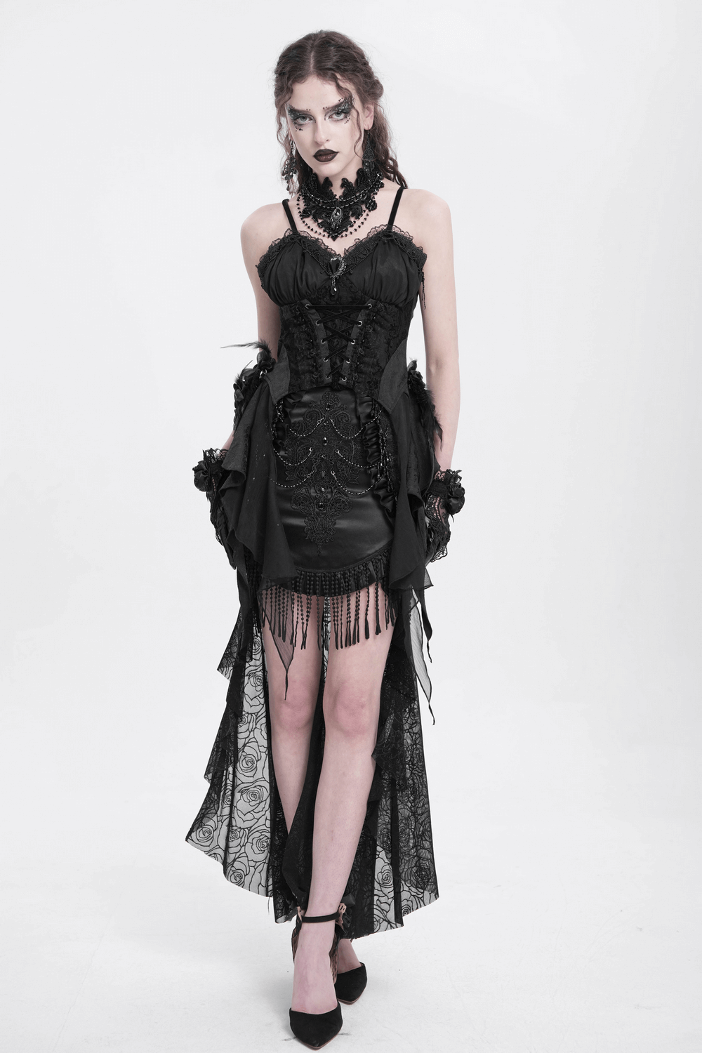 Gothic black dress with lace details, floral accents, and fringe, perfect for a dramatic punk or romantic look.