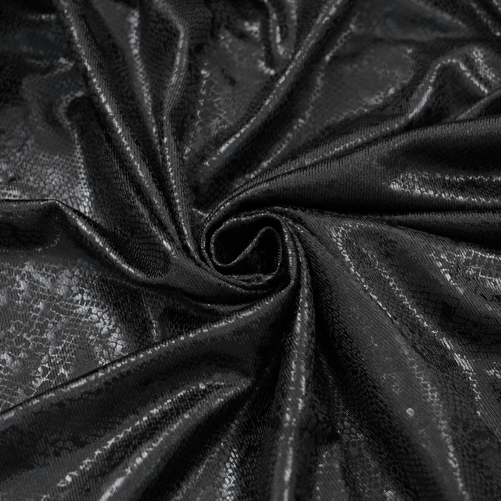 Close-up of textured black fabric with a shiny finish, perfect for gothic-inspired fashion designs.