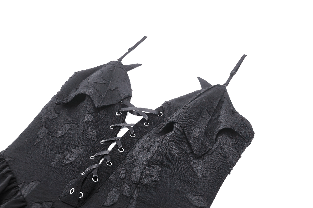 Close-up of Gothic lace-up black dress featuring layered ruffles and intricate lace-up front detail.