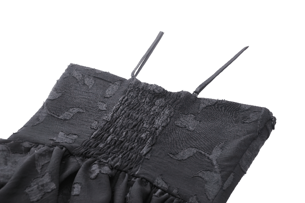 Close-up of a black Gothic lace-up dress with smocked bodice and delicate ruffles, showcasing dark elegance.