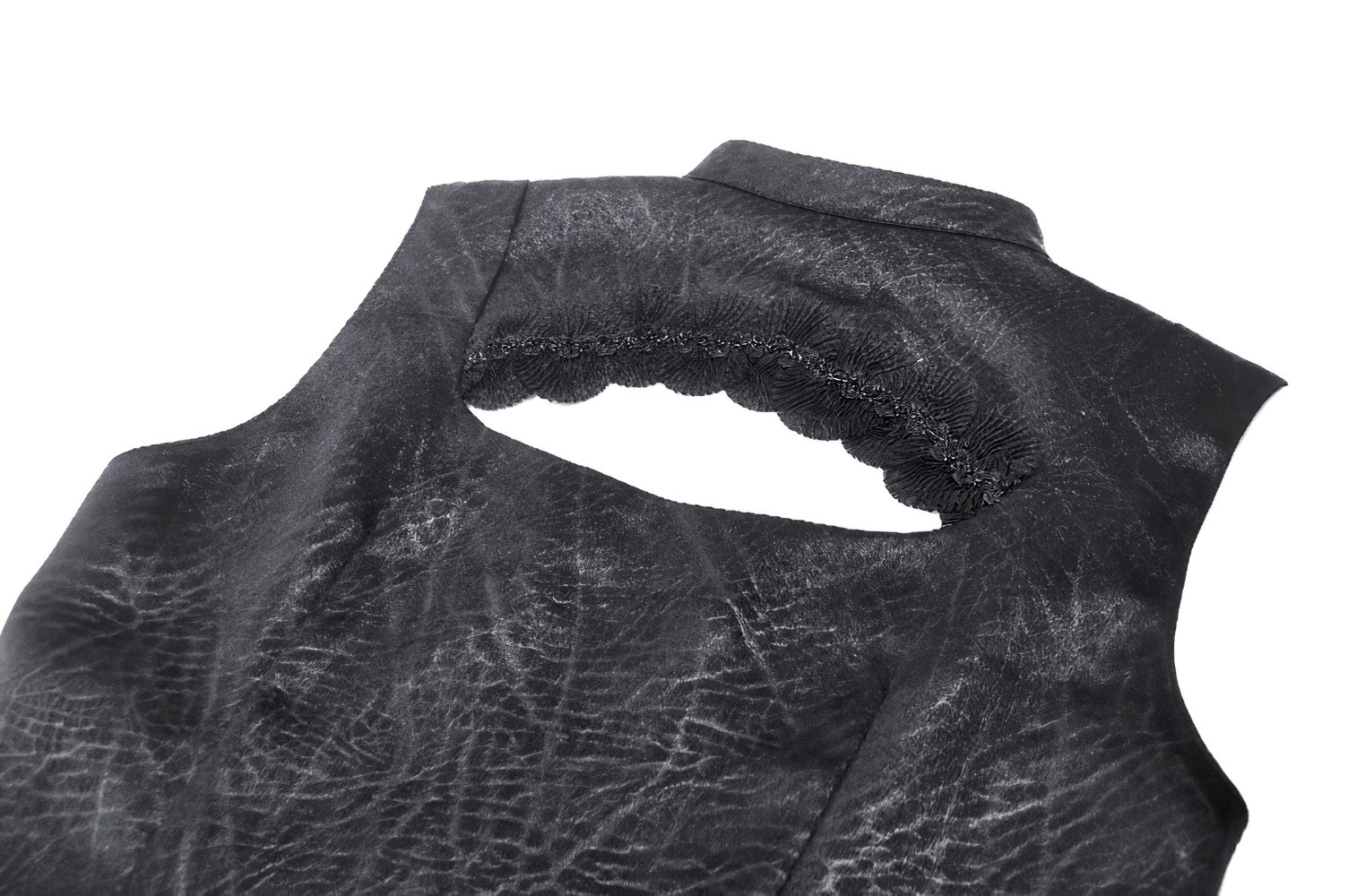 Close-up of the back lace detail of a Gothic-inspired black sleeveless top with ruffle trim.