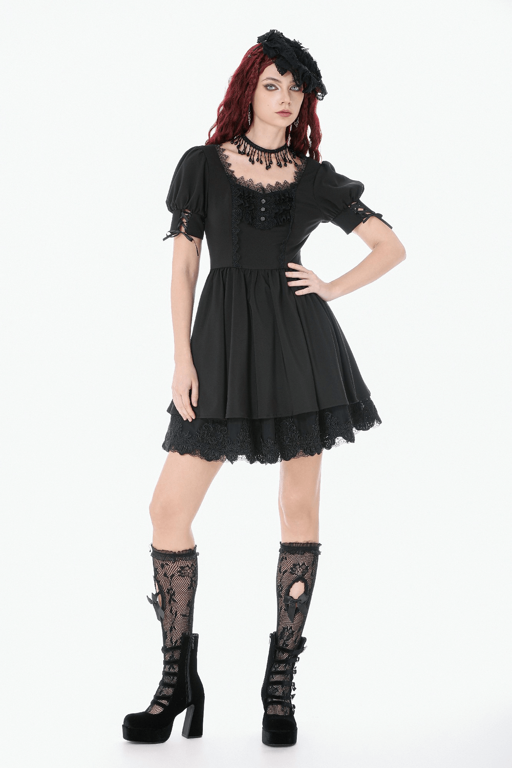 Gothic Lace-Up Short Sleeve Ruffle Dress with Corset Detail worn by model, featuring puff sleeves and lace accents.