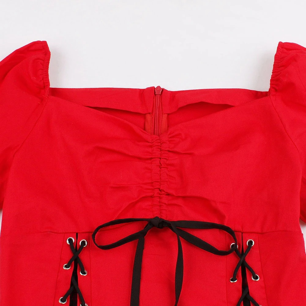 Close-up of gothic lace-up red dress showing zipper and stylish lace details for women's vintage fashion.