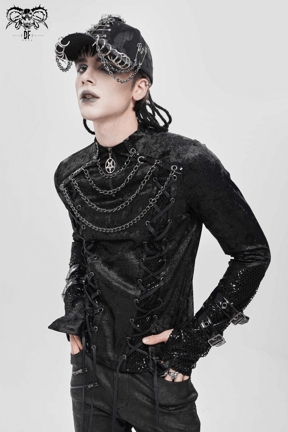 Gothic Lace-Up Top with Chains and Pentagram Pendant worn by model, featuring corset lacing and metal chain details.