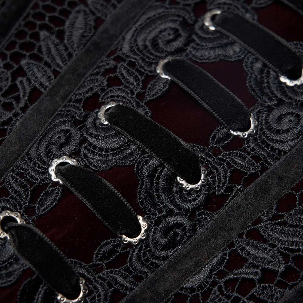 Close-up of gothic lace-up velvet corset showcasing intricate rose lace and elegant silver eyelets.