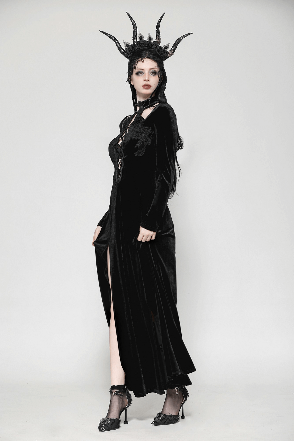 Gothic lace-up velvet dress with ruffled details and a stylish slit, perfect for dark, elegant fashion.