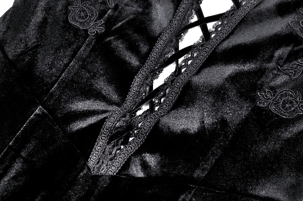 Close-up of Gothic lace-up velvet dress highlighting ruffled details and intricate lace trim.