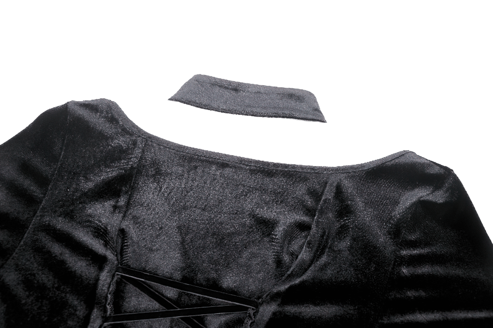 Close-up of Gothic lace-up velvet dress showcasing ruffled details and elegant neckline.