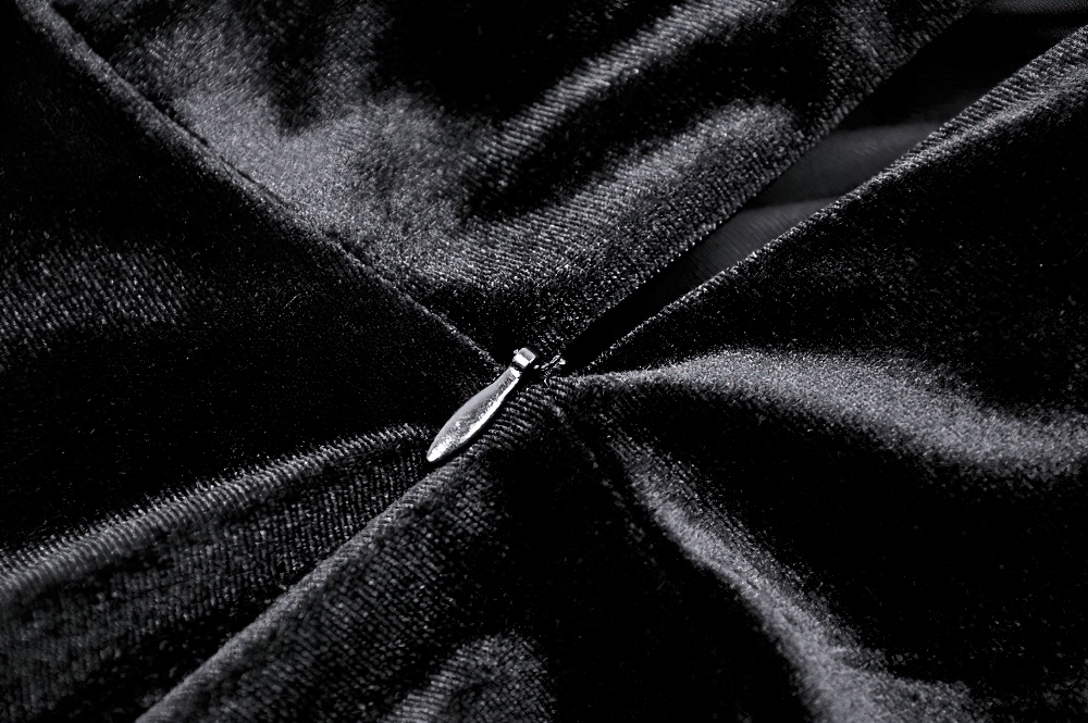 Close-up of the sleek zipper detail on a gothic velvet dress with rich texture.