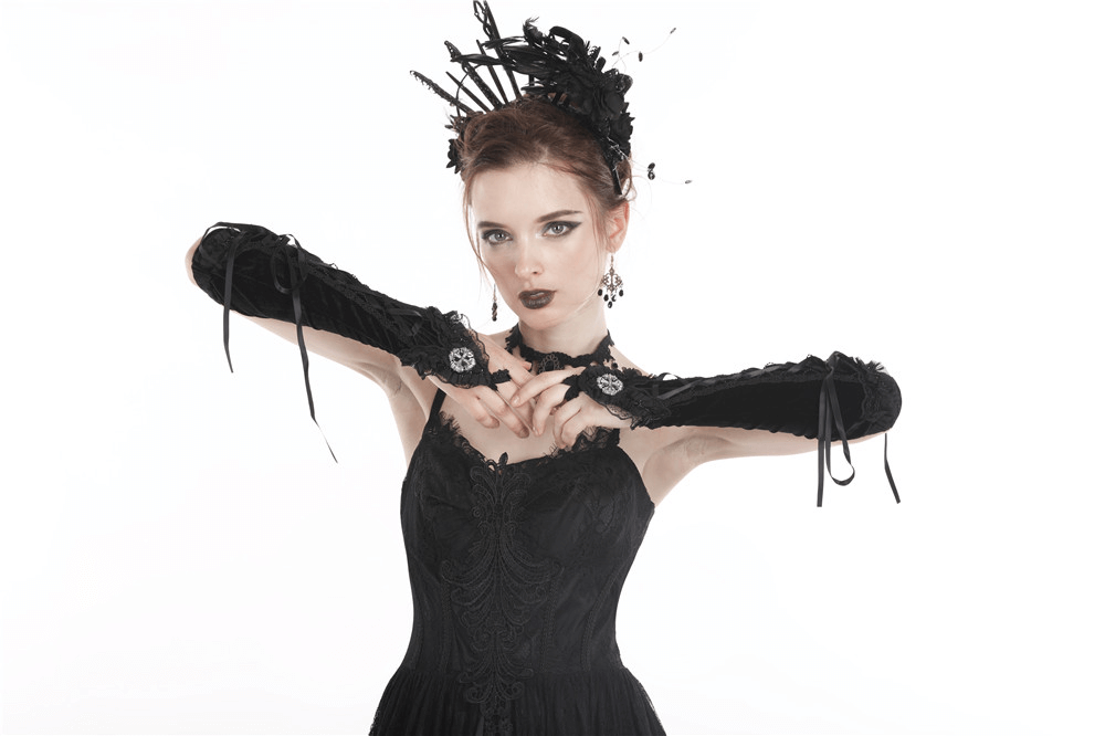 Gothic lace-up velvet fingerless gloves for women; Victorian elegance in black with intricate lace details.