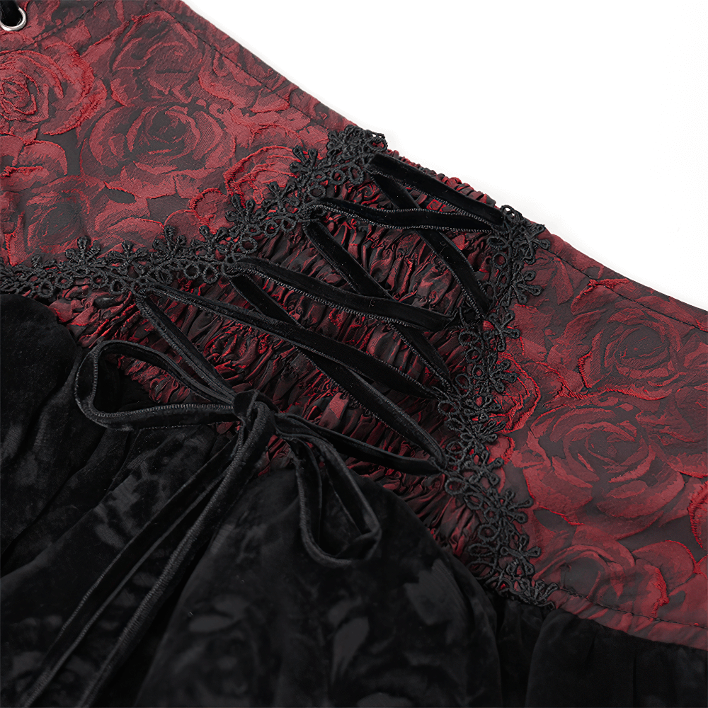 Close-up of a Gothic lace-up velvet skirt showcasing embroidered roses and intricate lace trim details.