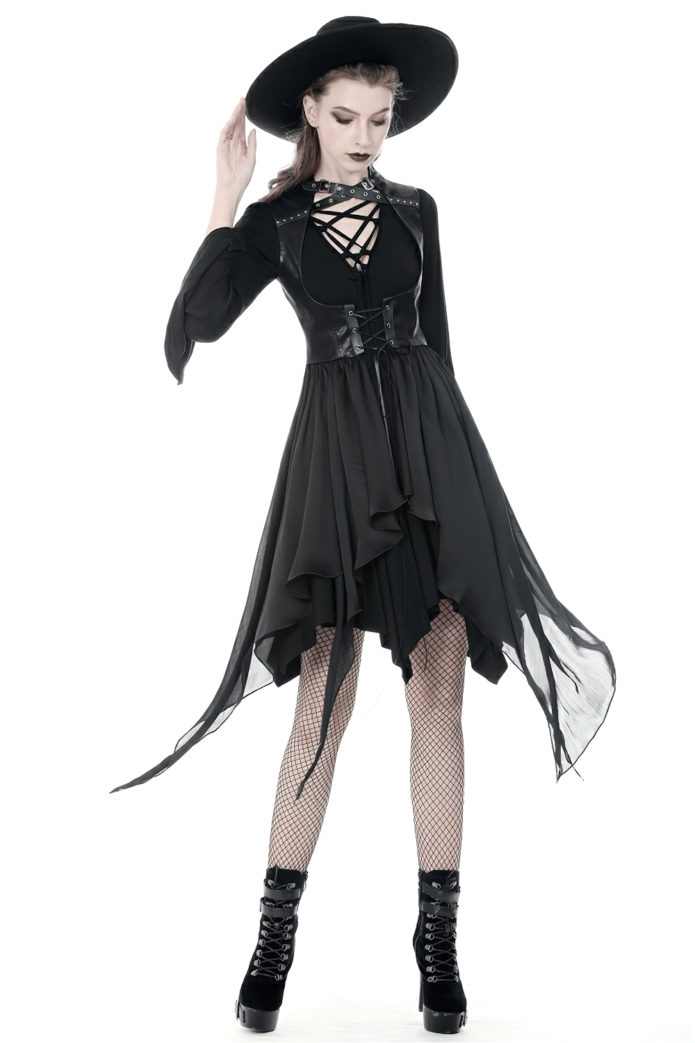 Gothic lace-up waistcoat with asymmetrical hem, paired with a stylish black hat and fishnet stockings.