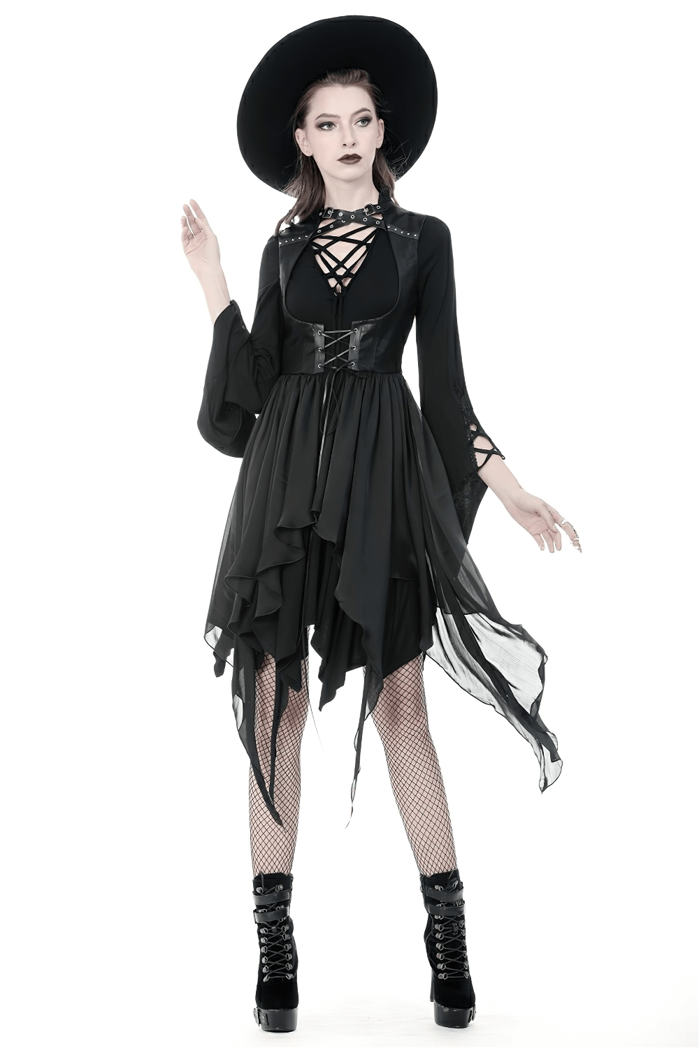 Gothic lace-up waistcoat with asymmetrical hem, paired with a stylish black hat and fishnet stockings.