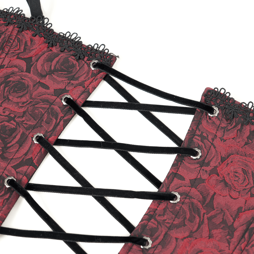 Close-up of wine red gothic lace-up corset with floral detailing and elegant black ruffle trim.