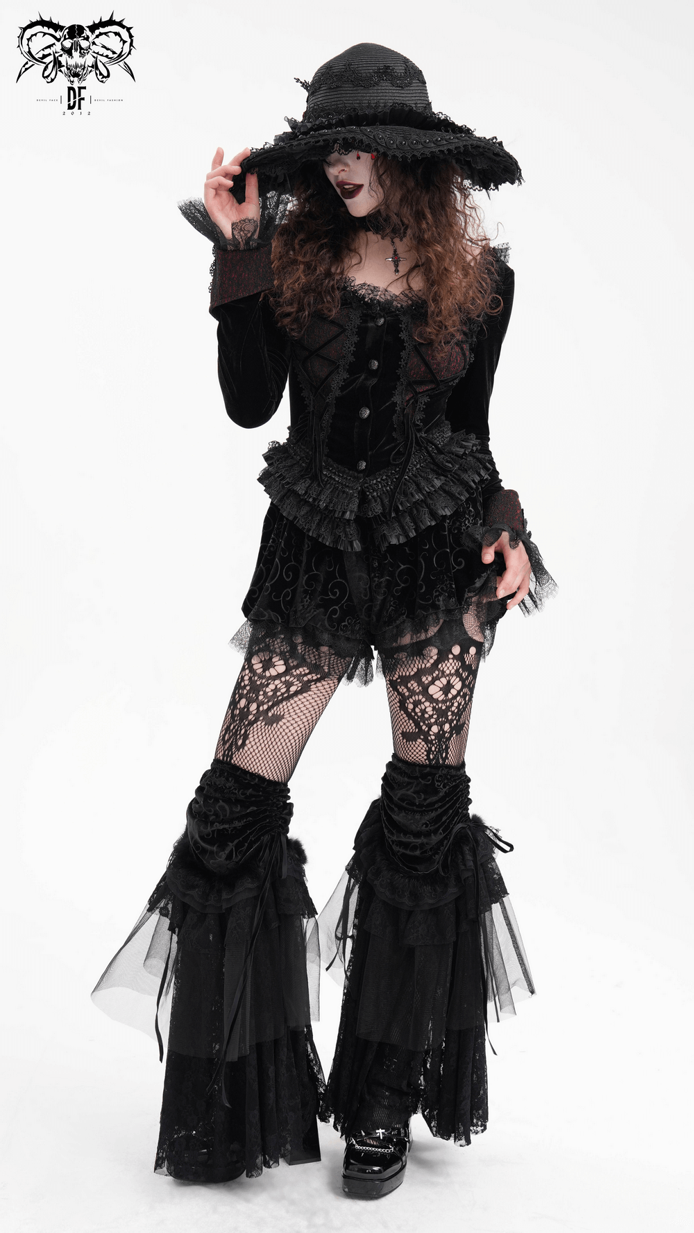 Gothic lace-up women's top with ruffle trim sleeves, paired with dramatic accessories for a Victorian-inspired look.