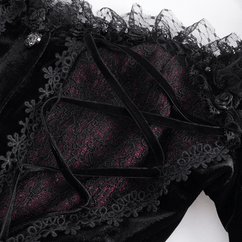 Close-up of Gothic lace-up women's top with ruffle trim, showcasing intricate lace and button details.