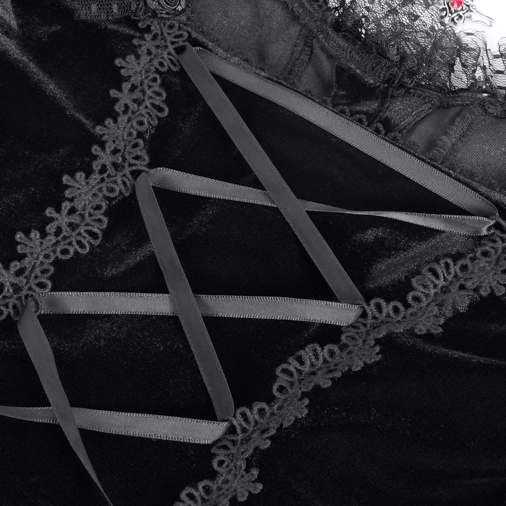 Close-up of gothic lace-up detail on women's top featuring ruffled trim sleeves and elegant black velvet fabric.