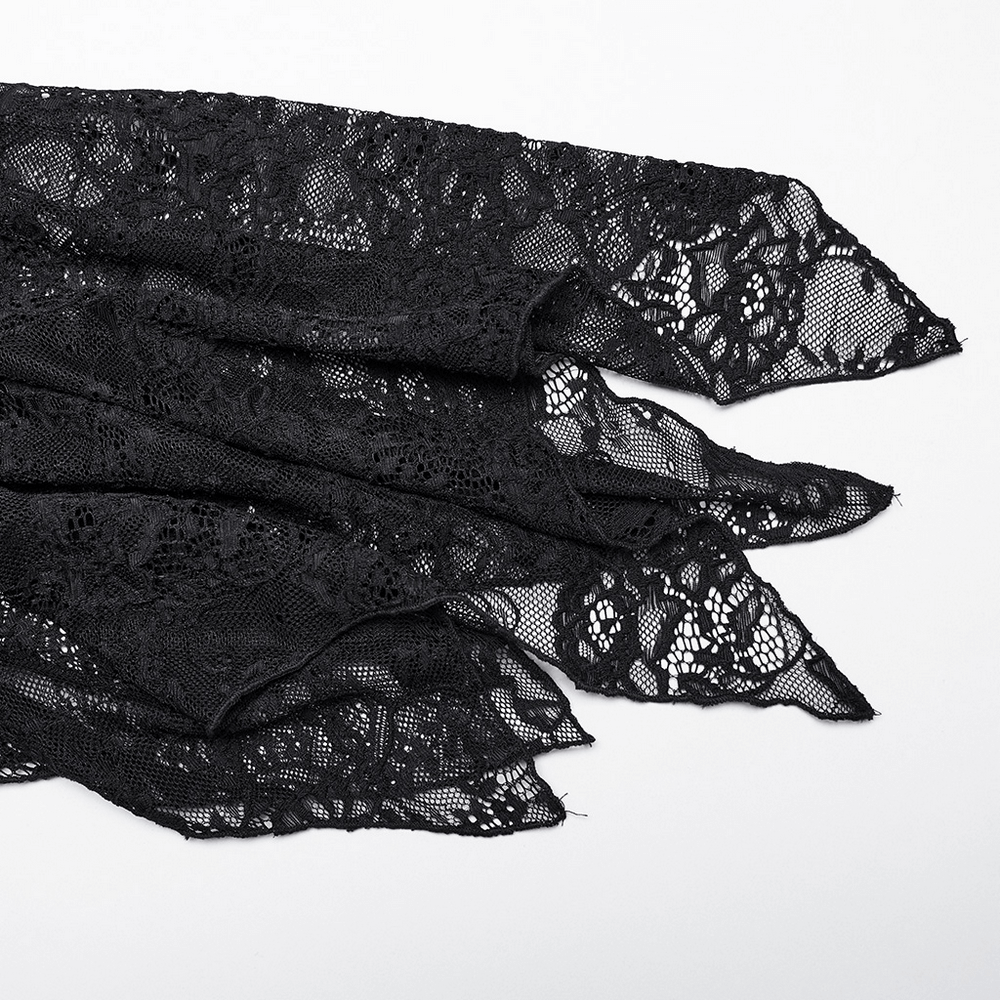 Close-up of black lace fabric showcasing intricate patterns, perfect for Gothic fashion or elegant designs.