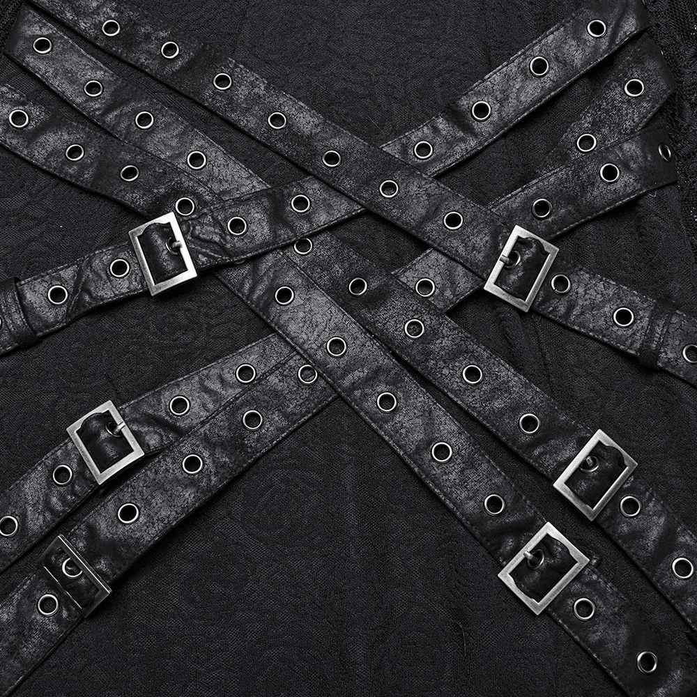 Close-up view of crossed black straps with eyelets and buckles on a Gothic design, perfect for unique fashion styling.