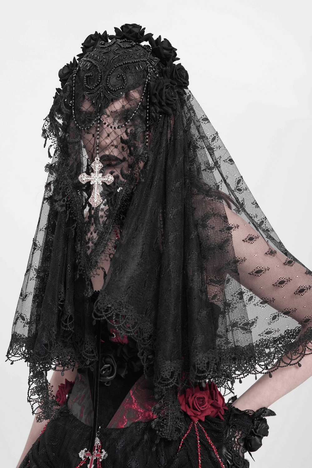 Elegant black lace veil with floral accents and a cross pendant, perfect for gothic or vintage-inspired outfits.