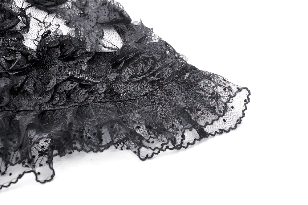 Intricate black lace ruffled hem detail of a gothic velvet maxi dress, showcasing elegance and gothic allure.