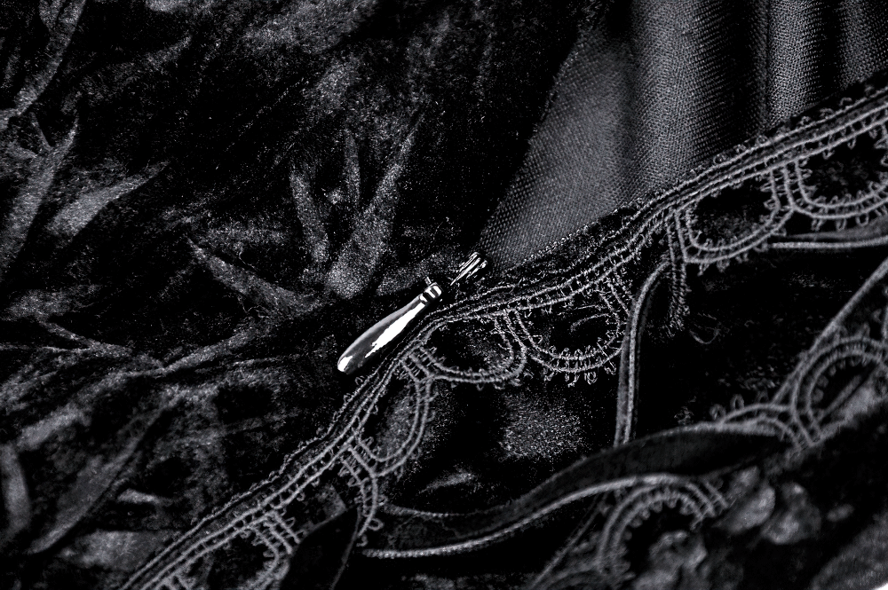 Close-up of gothic lace velvet fabric and zipper detail showcasing intricate lace design and luxurious texture.