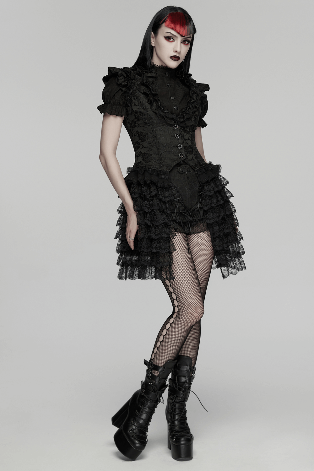 Gothic Lace Vest with Layered Skirt and Ruffled Detail showcased by a model in bold black fashion.
