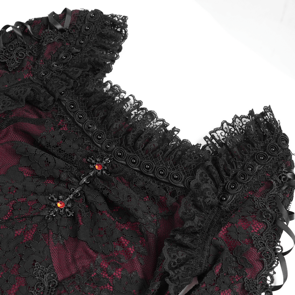 Close-up of gothic lace wine red and black mini dress showcasing intricate lace details and flared sleeves.