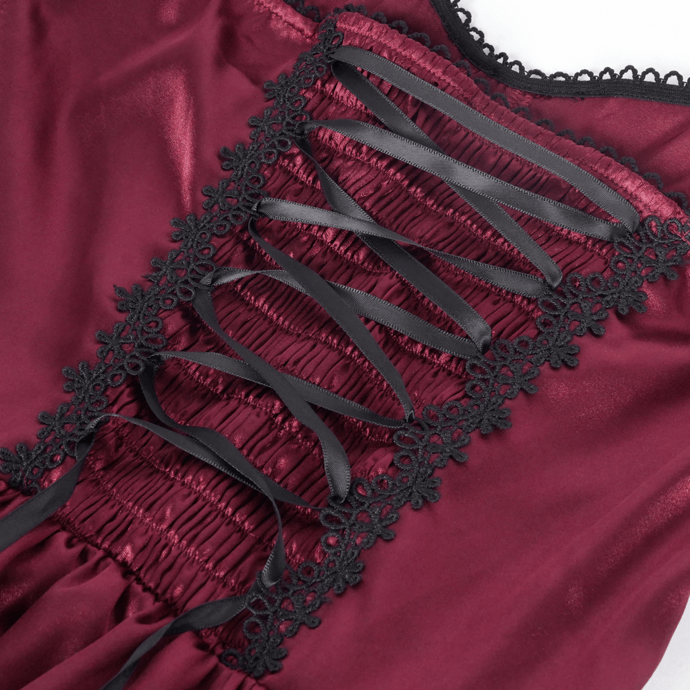 Close-up of corset back detailing with lace trim and dark satin ribbons on a gothic-inspired long dress.