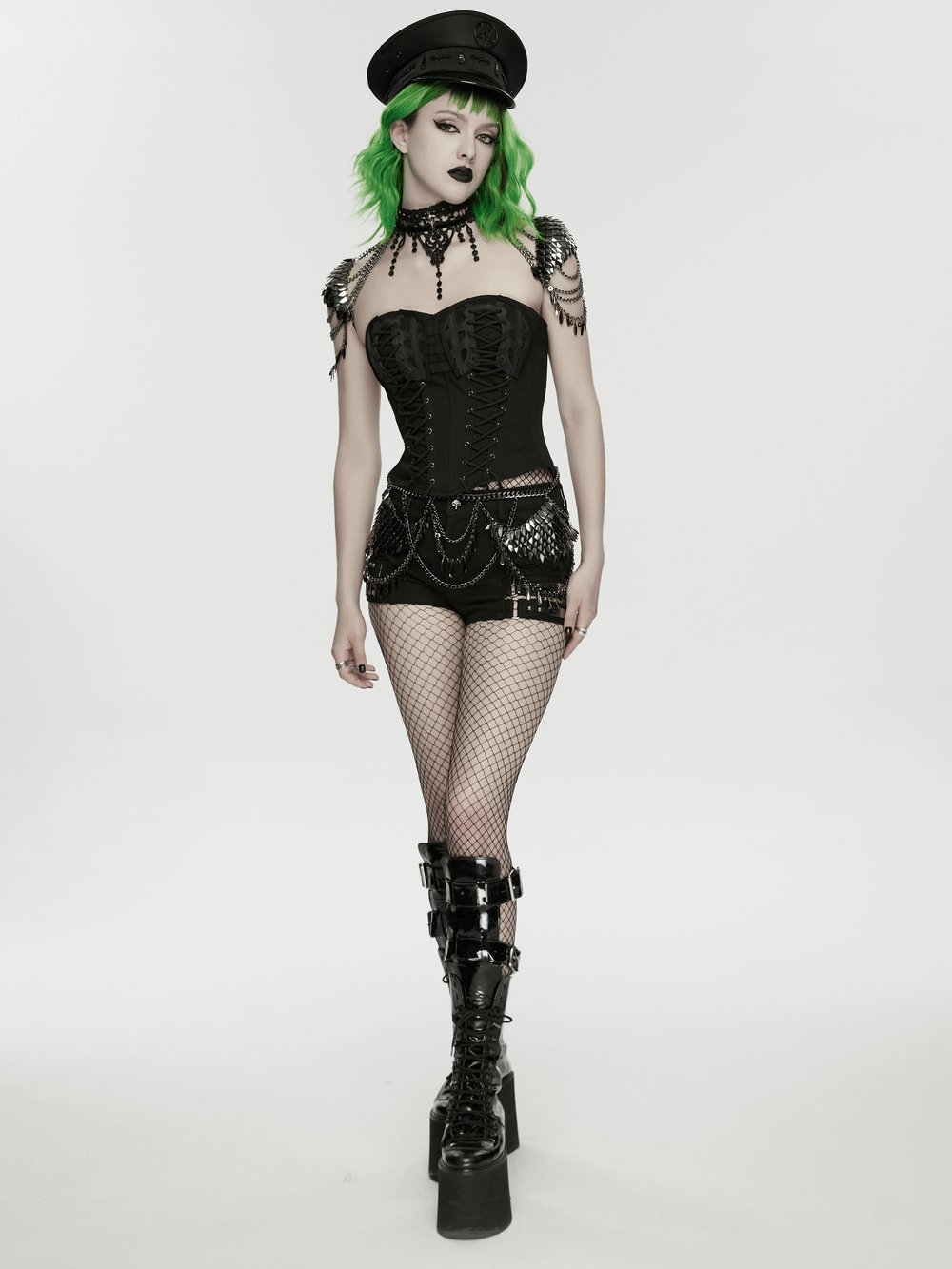 Alt Tag: Gothic Layered Metal Waist Chain with Blade Charms on model in black goth outfit, layered chains and blade charms statement body jewelry