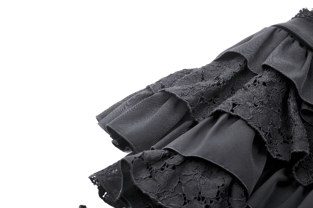 Black gothic mini skirt featuring layered ruffles and lace details, perfect for adding flair to any gothic wardrobe.