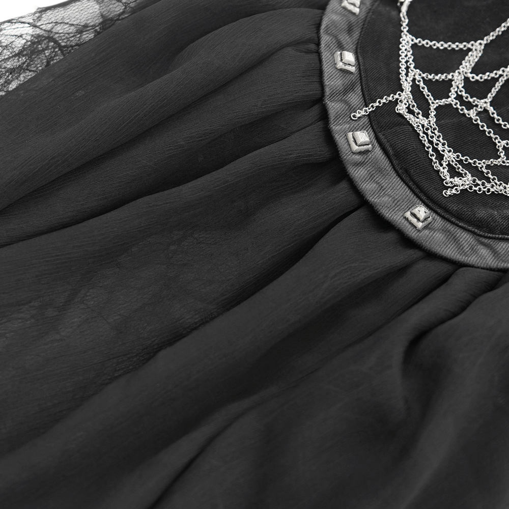 Close-up of gothic tulle shorts showcasing lace trim and decorative chain details for a punk-inspired look.