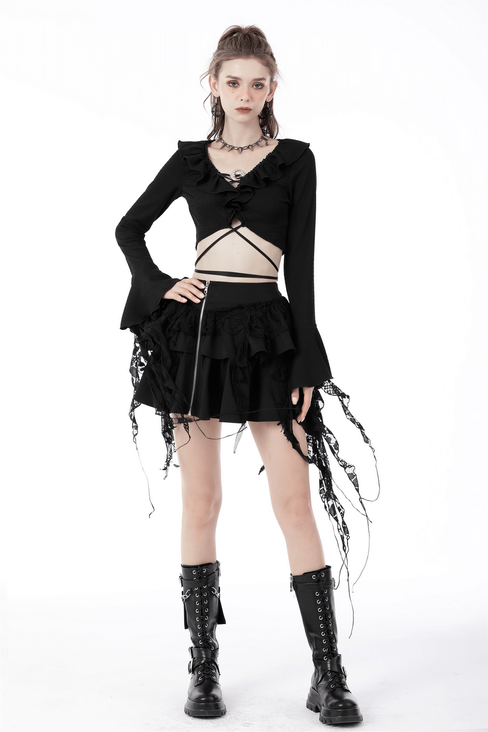 Gothic layered mini skirt with ruffles, zipper accent, and lace details, styled with edgy top and combat boots.