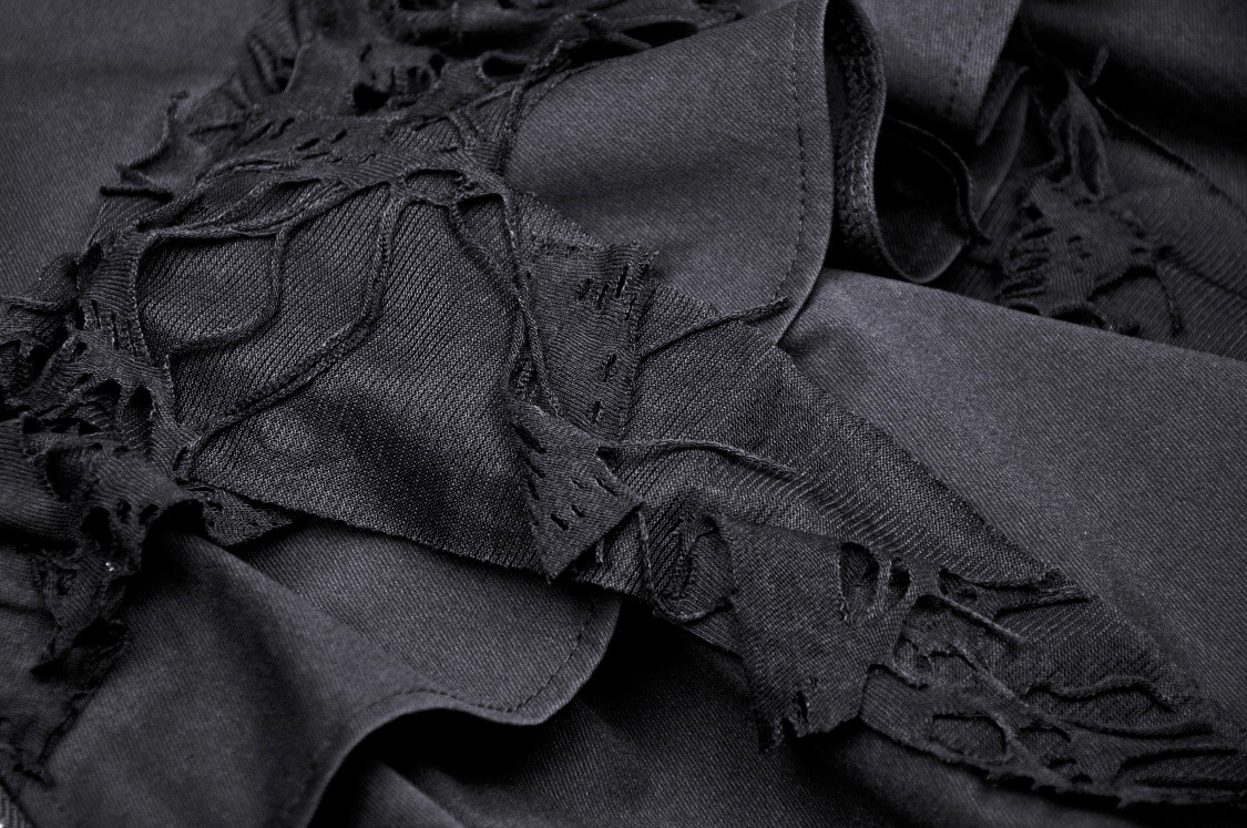 Close-up of black fabric with lace and ruffle details, ideal for a Gothic layered skirt with edgy design elements.