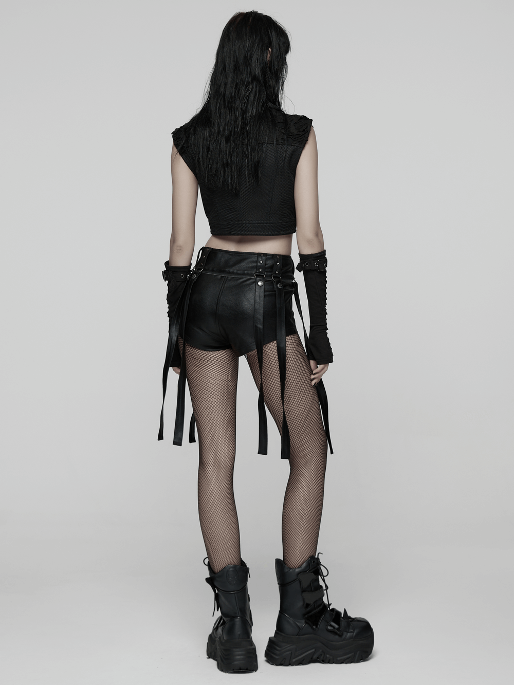 Gothic Layered Tulle Skirt-Shorts with Punk Studs and Skulls worn by a model in a moody setting.
