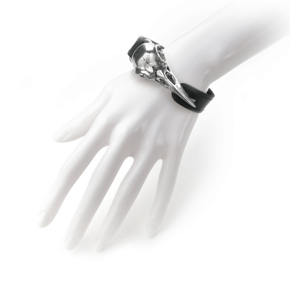 Gothic leather bracelet featuring a pewter raven skull on a stylish black strap, perfect for dark aesthetic lovers.