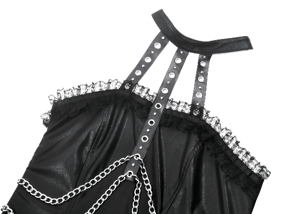 Close-up of gothic leather dress with chain details and halter neck design, featuring intricate ruffles and edgy style.