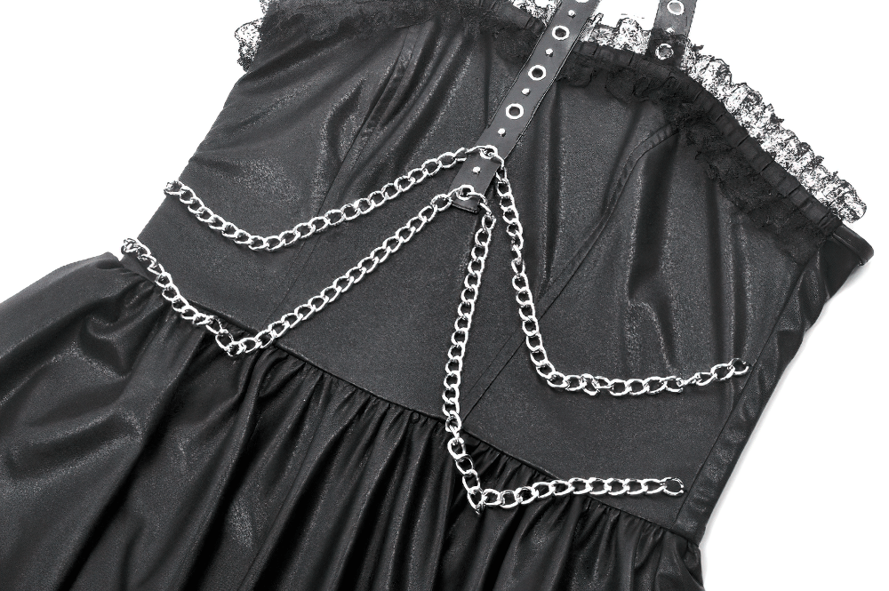 Gothic leather dress showcasing chain details and a ruffled halter neck, perfect for bold, edgy fashion.