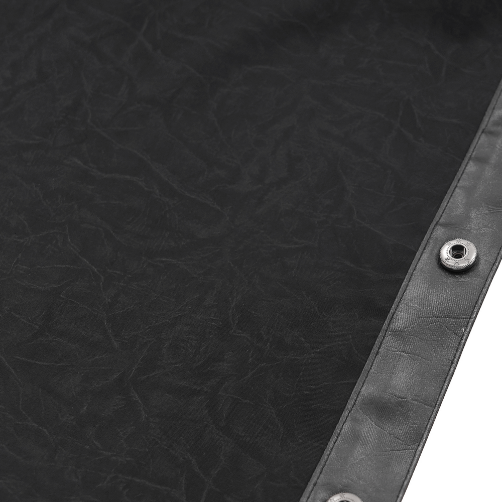 Close-up of Gothic black leather fabric showcasing eyelet details and button closure for men's shirt design.