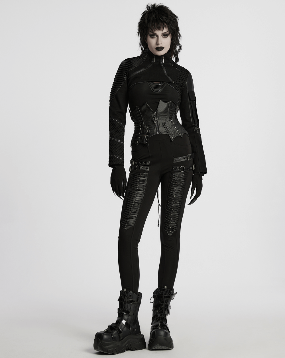 Gothic leather waist corset with zipper and lace-up back, styled with black punk outfit and dramatic boots.